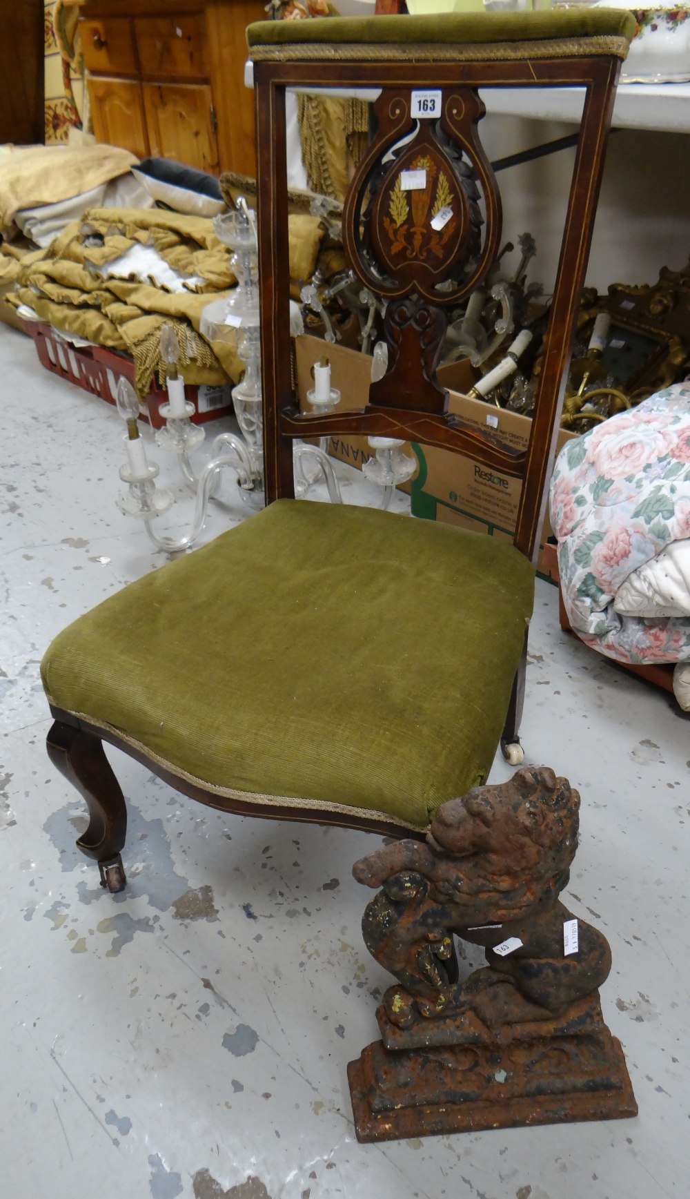 An inlaid and marquetry antique hall chair together with an antique cast iron lion-form 'flat