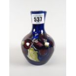 A Moorcroft blue ground floral narrow neck vase, 12cms high Condition reports provided on request by