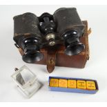 A vintage leather cased set of sporting binoculars together with a boxed miniature stereoscope