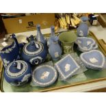 A parcel of Wedgwood blue Jasperware and a green similar flared vase Condition reports provided on