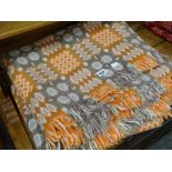 A traditional Welsh wool blanket in orange and green ground decorated in geometric squares Condition