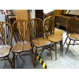 A set of twentieth century country oak wheel back dining chairs Condition reports provided on