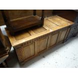 A good antique reproduction panelled blanket chest with carved supports Condition reports provided