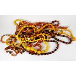 Nine strands of amber or style bead necklaces Condition reports provided on request by email for