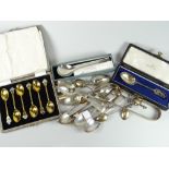 A parcel of silver spoons including a cased set of six silver gilt spoons with floral enamel