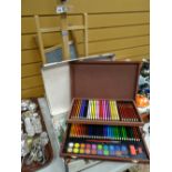 A Daler-Rowney table easel and a modern suitcase containing art materials and a washboard