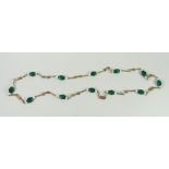 Yellow metal green stone and pearl necklace Condition reports provided on request by email for