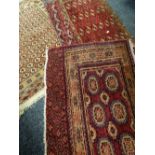 Three Persian red ground rugs with geometric borders, 145 x 83cms, 121 x 100cms & 124 x 75cms