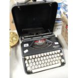 A retro Olympia Splendid 66 cased typewriter Condition reports provided on request by email for this