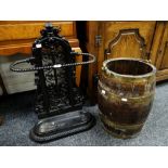 A painted late-Victorian cast iron floral stick stand with rope twist oval holder and lined base,