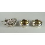 Matched three-piece silver condiment set comprising a pair of 925 repousse salts and similar