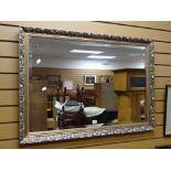 A modern gilt framed bevelled wall mirror Condition reports provided on request by email for this