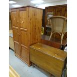 A double pine wardrobe and a gate-leg table Condition reports provided on request by email for