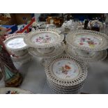 A part Vienna floral dessert service with ribbon borders and including six cake stands Condition