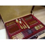Cased canteen of Nivella Solingen cutlery, gold plated in fitted suitcase with pamphlet and original