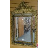 Antique gilt metal framed bevel plated hanging wall mirror having central rectangular mirror plate