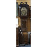 A nineteenth century oak encased brass dial 8-day longcase clock having silvered chapter dial