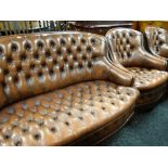 Mid-twentieth century button back leather three-piece suite comprising two-seater settee and pair of