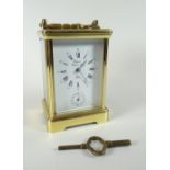 Late twentieth century brass encased carriage clock with rectangular white enamel dial bearing Roman