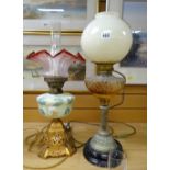 Two oil lamps - one with gilt metal fancy base and opaline floral reservoir and good tinted shade,