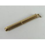 Small 9ct gold engine turned propelling tooth pick, 5.9grams approx. Condition reports provided on