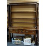 A small nineteenth century Welsh dresser, the base with three marquetry decorated drawers and a