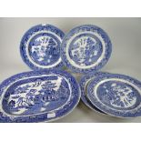 Four blue & white plates (some with chips) together with large blue & white dish, label for D J