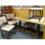 A vintage oak refectory-type breakfast table with floor level stretcher, 136cms long and four floral