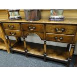 A good nineteenth century-style reproduction oak dresser-base having a single plank platform base