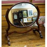 An early twentieth century mahogany oval toilet mirror on stand Condition reports provided on