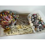 Two containers of costume jewellery, beads, pearls ETC Condition reports provided on request by