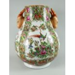A Famille Rose twin-handled vase Condition reports provided on request by email for this auction
