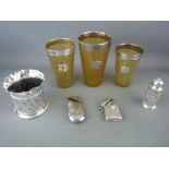 Three silver mounted horn beakers, a twist form vase, a cylindrical dusting pot and two vesta cases,