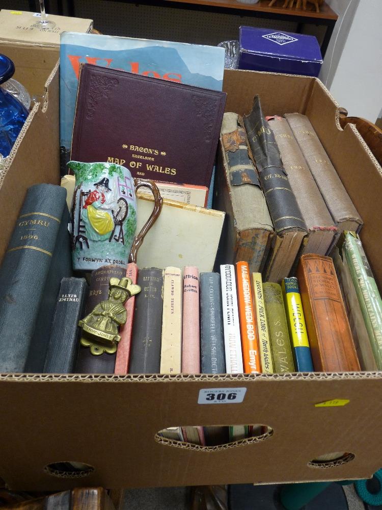 Parcel of Welsh books including a Bacon's fold-up map of Wales, Welsh jug and Welsh lady door