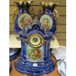 Fine Staffs ceramic clock garniture set comprising clock on stand and pair of vases