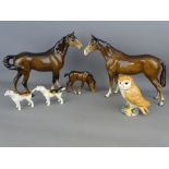 Two brown Beswick horses and a foal, a model of an owl and two hunting hounds, all with Beswick