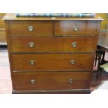 Dark mahogany chest of three long and two short drawers with brass ring handles