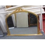 Large gilt framed bevelled edge arch shaped overmantel mirror