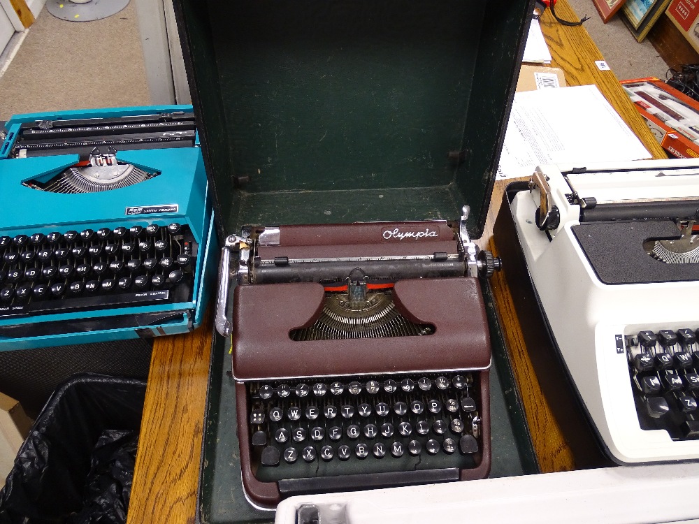 Three vintage cased typewriters - Olympia, Silver Reed 500 and Smith Corona