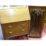 Oak two drawer writing bureau and a single door glazed wall hanging corner cupboard