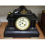 Excellent slate mantel clock with pillar supports and steeple top