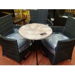 Parcel of three as new two tone rattan patio chairs and a circular 'Werzalit' metal based table