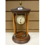 Pendulum mantel clock on pillared supports with drum cased movement