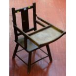 Child's seat with tray, possibly part of a high chair