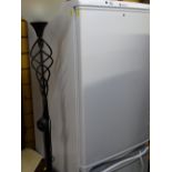 Hotpoint Aquarius upright fridge freezer and a black finished modern metal twist uplighter E/T