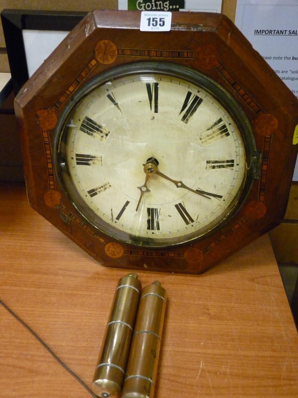 Inlaid pendulum wall clock in octagonal form