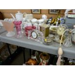 Two pieces of cranberry glass, Waterford crystal clock, a brass mantel clock by Koma with glass