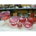 Seven pieces of cranberry glassware