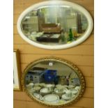 Fine oval framed bevelled wall mirror and another oval bevelled wall mirror