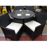 As new black rattan patio dining set of circular table and four chairs
